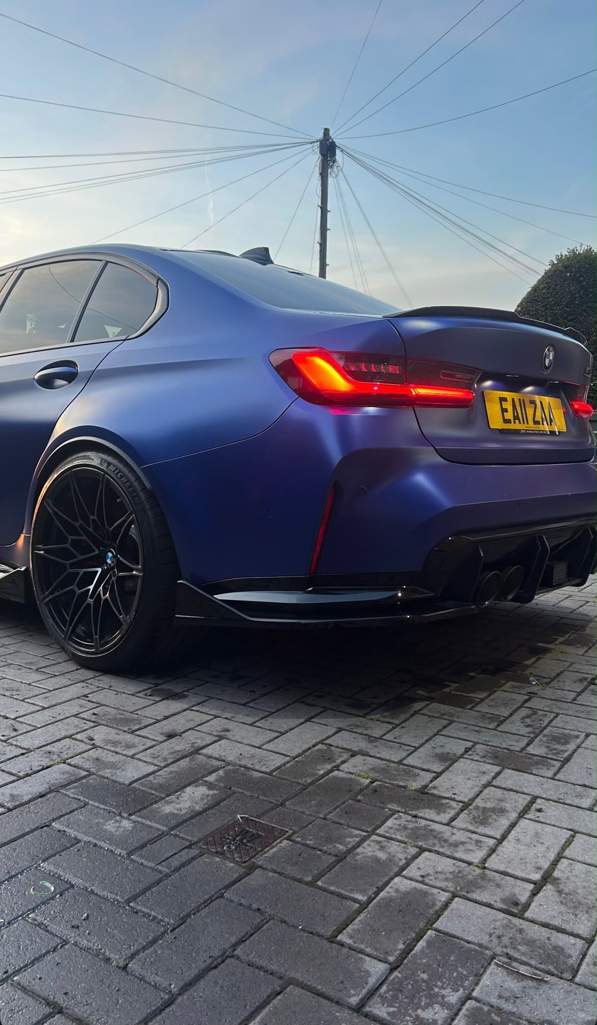 Blue BMW rear three-quarter exterior